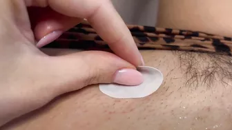 Tattoo master in leopard panty doing temporary tattoo