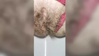 Schoolgirl with small ass but big hairy pussy pissing for you super mega closeup