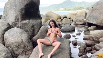 Naked Brunette Masturbates with Oil on a Beach