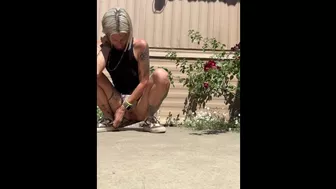 Piss Slut pissing by her roses!