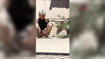 Piss Slut pissing by her roses!