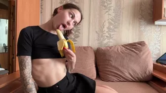 Hot brunette sweetly licks a banana