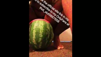 Stretched out pussy lips shoved around huge watermelon