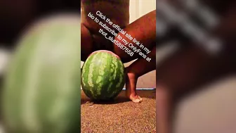 Stretched out pussy lips shoved around huge watermelon