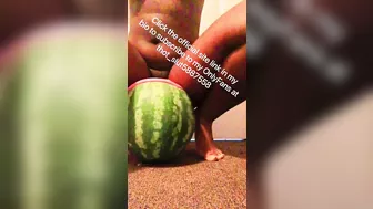 Stretched out pussy lips shoved around huge watermelon