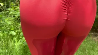 A beauty in leggings pees in nature