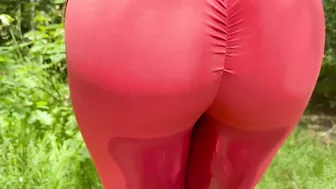 A beauty in leggings pees in nature