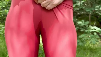 A beauty in leggings pees in nature