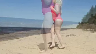 Juicy MILF in a pink swimsuit, on the beach