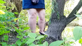 Hot MILF takes off her panties at the lake and pisses her legs spread wide