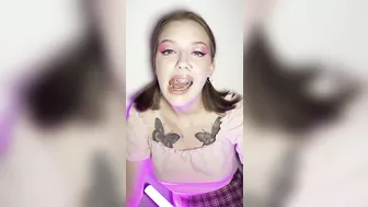 Metal mouth tour. Schoolgirl with braces showing her uvula