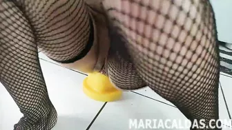 Maria Caldas anal fucks a gigantic yellow dildo