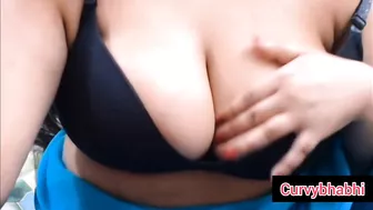 Sexy indian curvybhabhi teasing and pressing her huge tits wearing blue saree