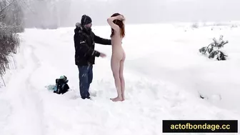 Naked barefoot Greta tied up in the snow.