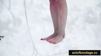 Naked barefoot Greta tied up in the snow.