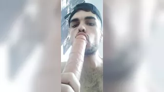 Sucking a big fat dildo