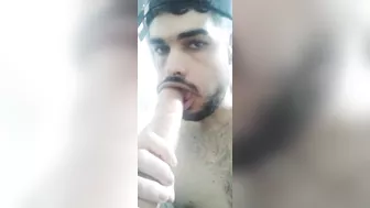 Sucking a big fat dildo