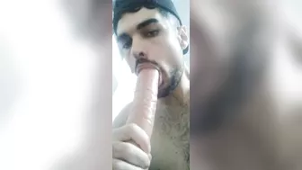 Sucking a big fat dildo